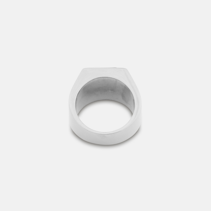 Silver ring on a light gray background