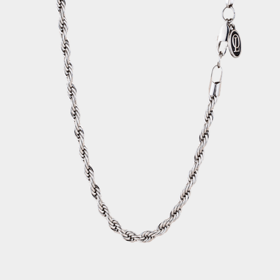 Silver chain necklace on a white background