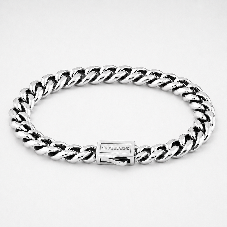 A silver-toned stainless steel curb link bracelet with a rectangular clasp engraved with the brand name 'OUTRAGE', shown on a clean white background.