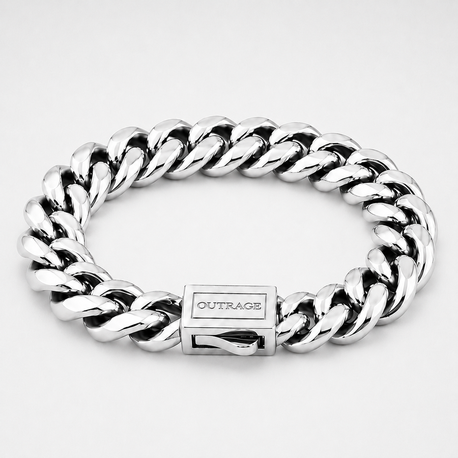 A silver-toned Cuban link chain bracelet with a polished rectangular clasp engraved with the brand name 'OUTRAGE', shown on a light gray background.