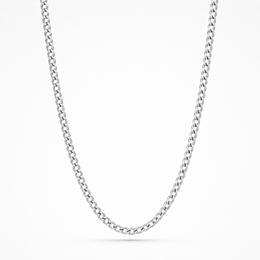 A classic silver-toned curb link chain necklace, shown draped in a U-shape against a clean white background.