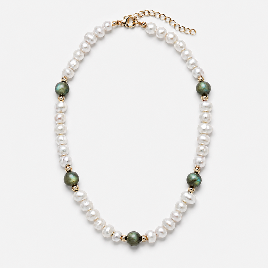 A pearl and green stone beaded necklace with gold-toned spacer beads and a gold clasp, shown on a light gray background.