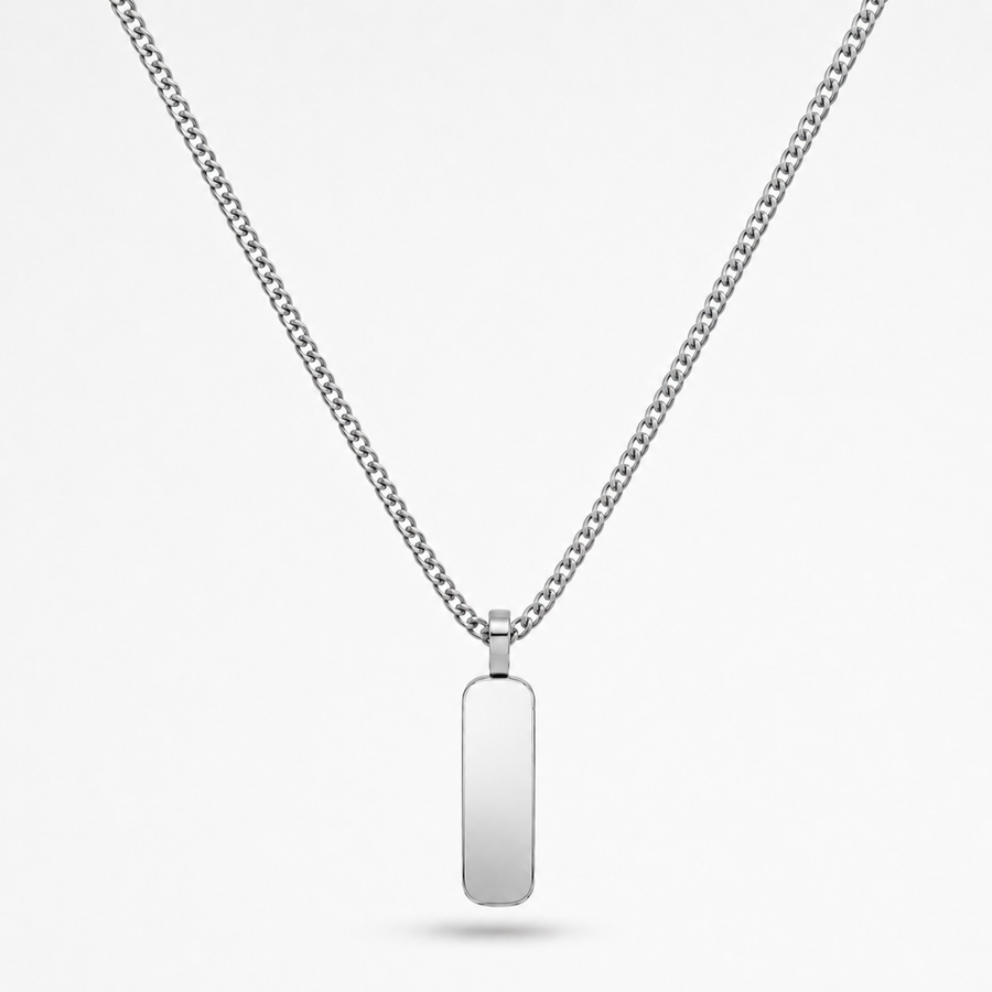 A silver-toned stainless steel chain necklace with a flat, polished rectangular dog tag pendant, shown against a light gray background.
