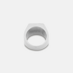 Silver ring on a light gray background