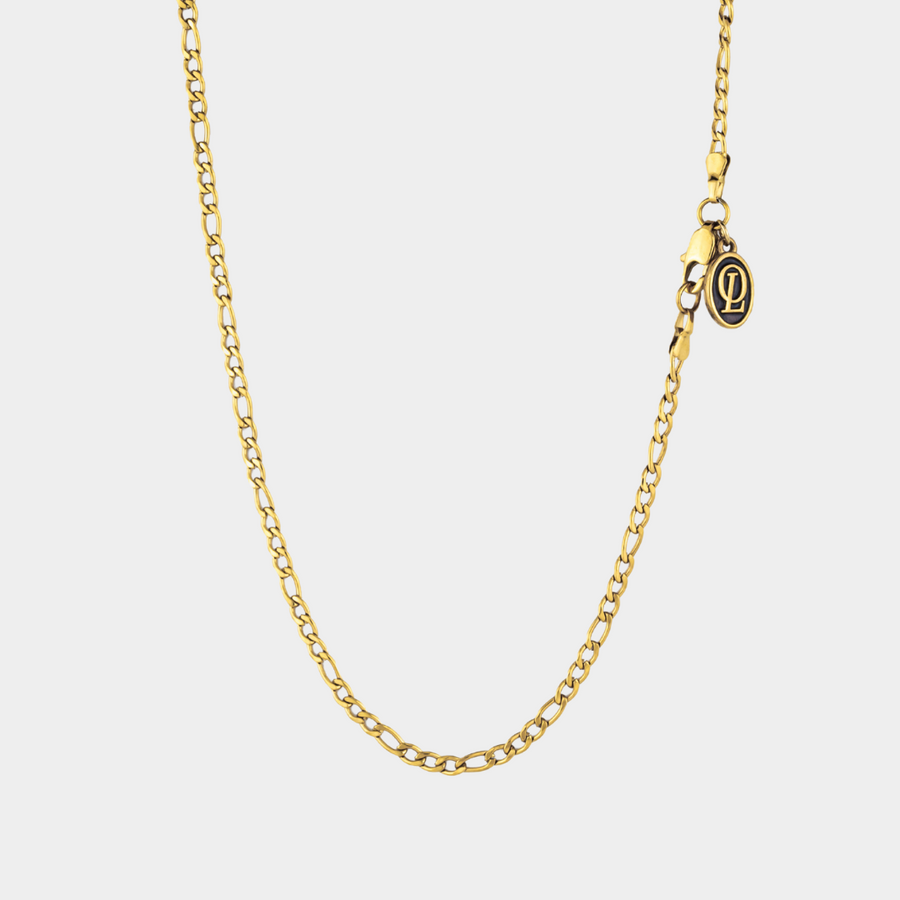 Gold figaro chain necklace 3mm on a white background