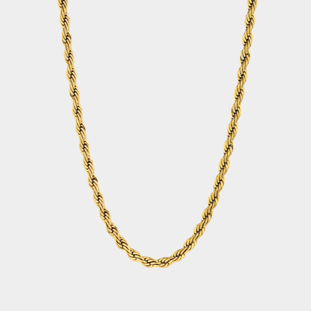 Gold rope chain necklace on a light gray background