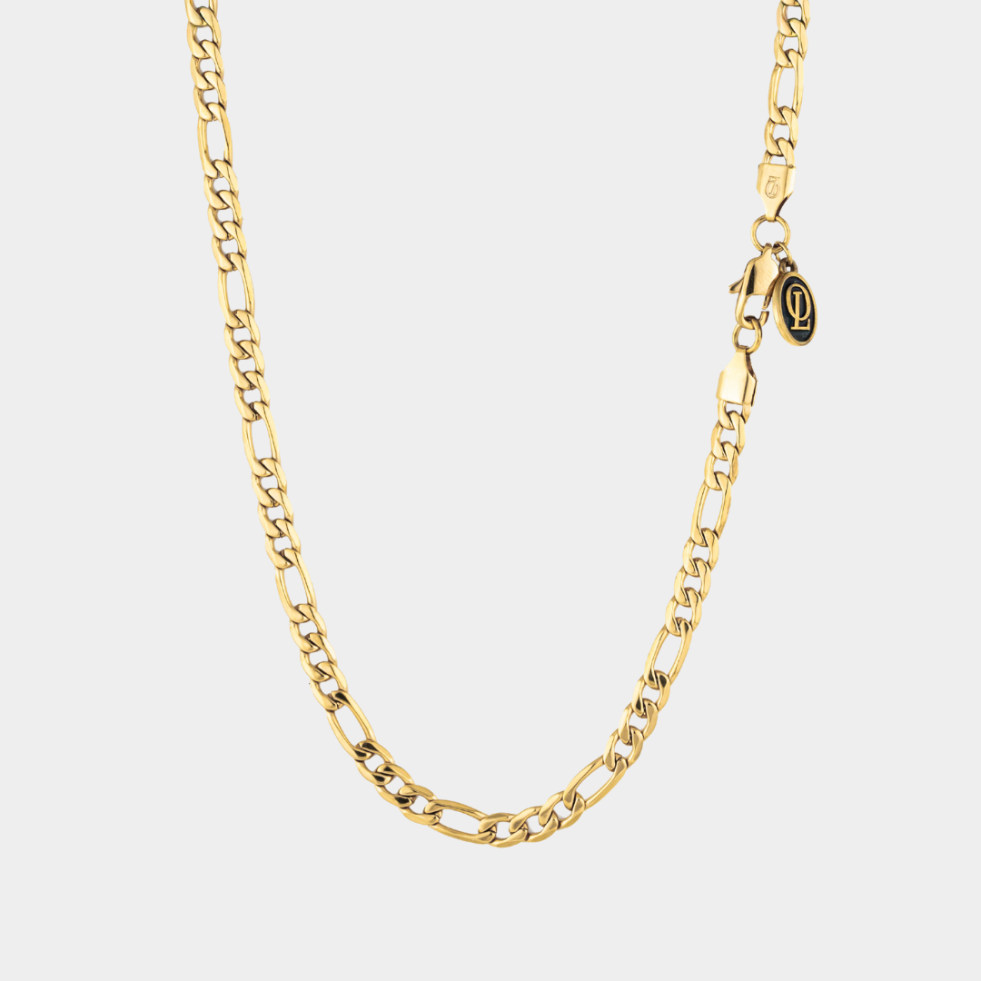 Gold figaro chain necklace 5mm on a white background