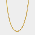 Gold chain necklace on a light gray background