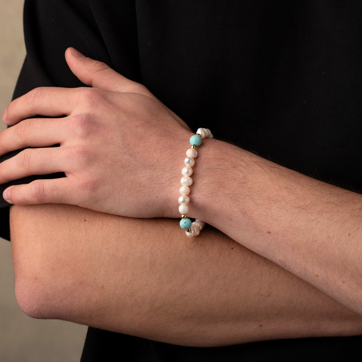 Man wearing turquoise stone pearls bracelet