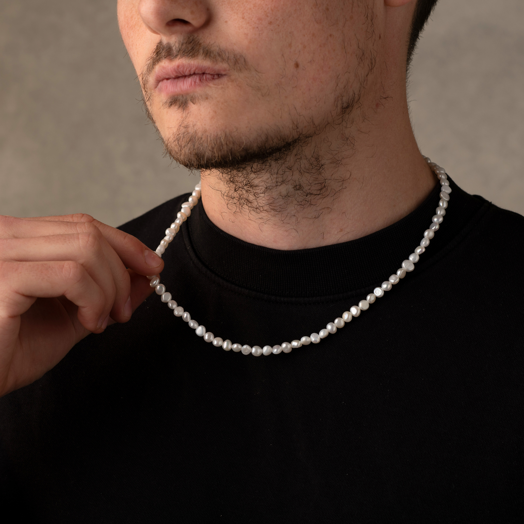 Man Wearing a Full Genuine Pearls Necklaces