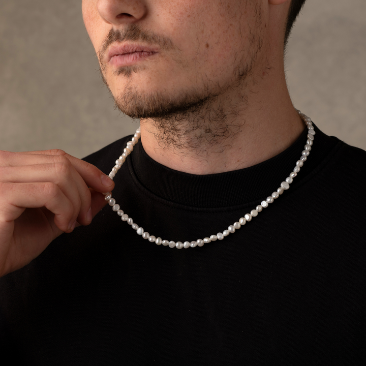 Man Wearing a Full Genuine Pearls Necklaces
