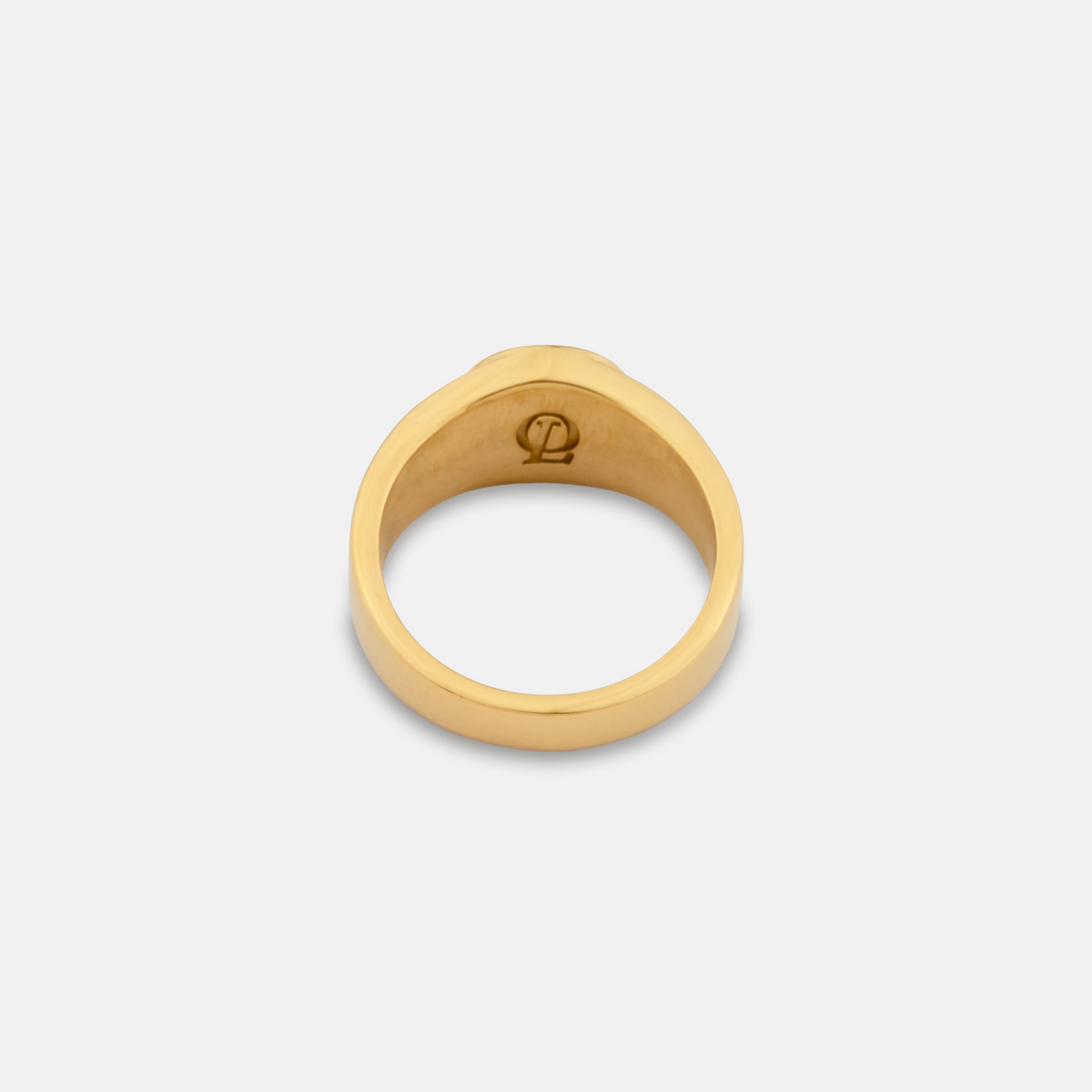 Gold ring with a logo on a light gray background