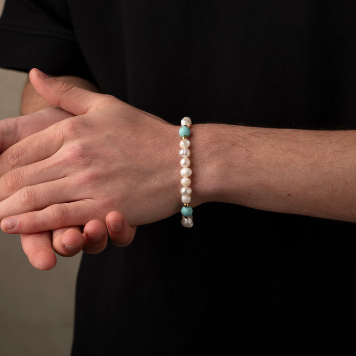 Man wearing turquoise stone pearls bracelet
