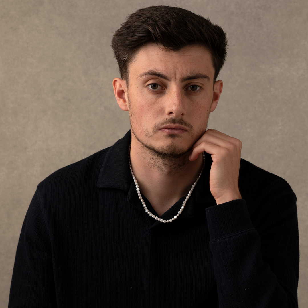 Man Wearing a Full Genuine Pearls Necklaces