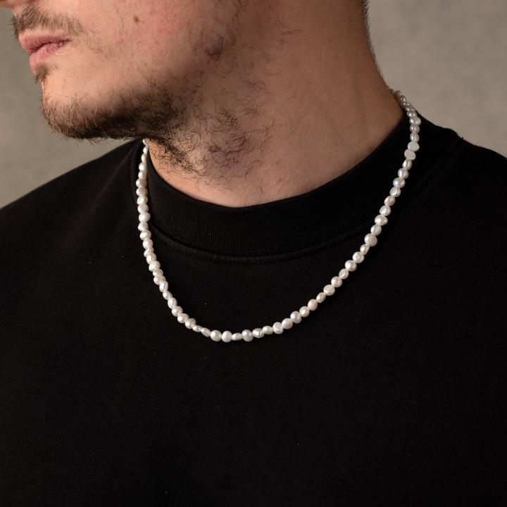 Man Wearing a Full Genuine Pearls Necklaces