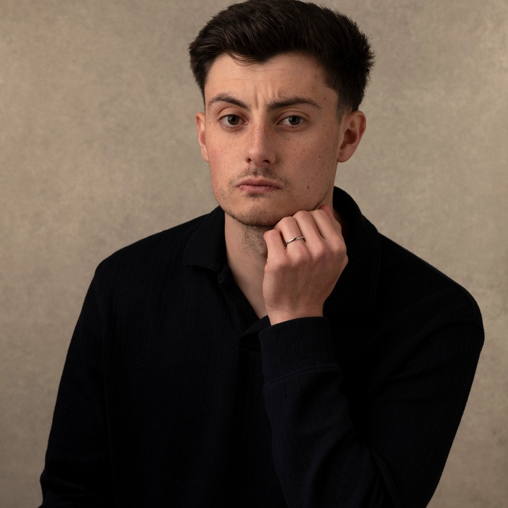 Man wearing a silver simple band ring 2mm
