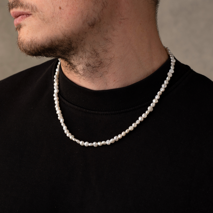 Man Wearing a Full Genuine Pearls Necklaces