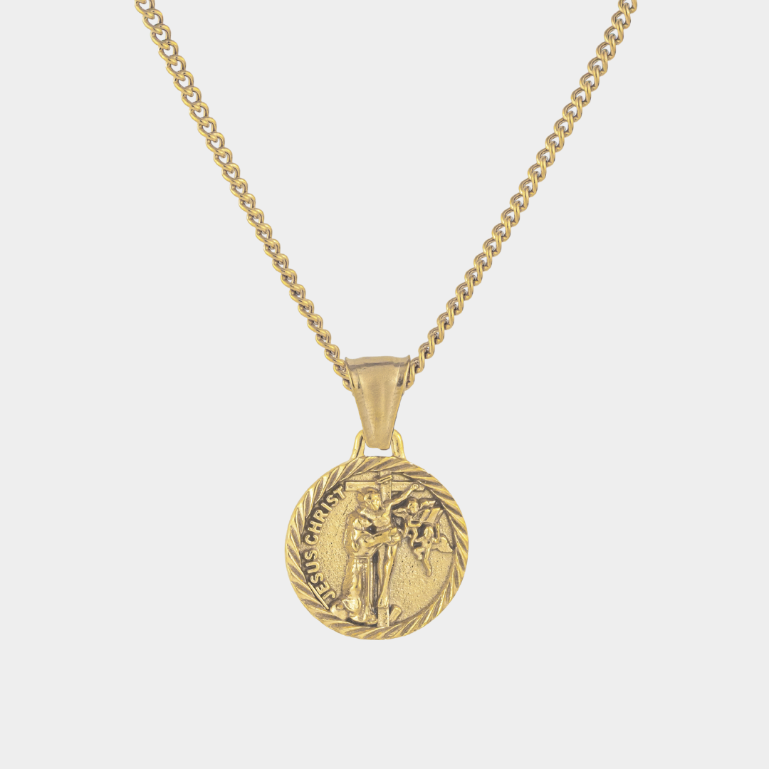 Gold Jesus Christ Necklace Pendant on a white background