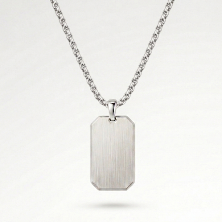 A silver-colored rectangular pendant necklace with a chain.