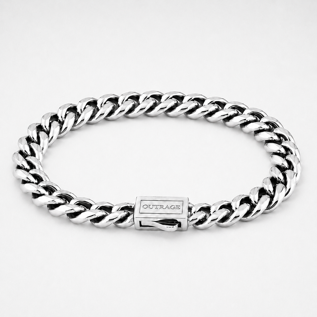A silver-toned stainless steel curb link bracelet with a rectangular clasp engraved with the brand name 'OUTRAGE', shown on a clean white background.