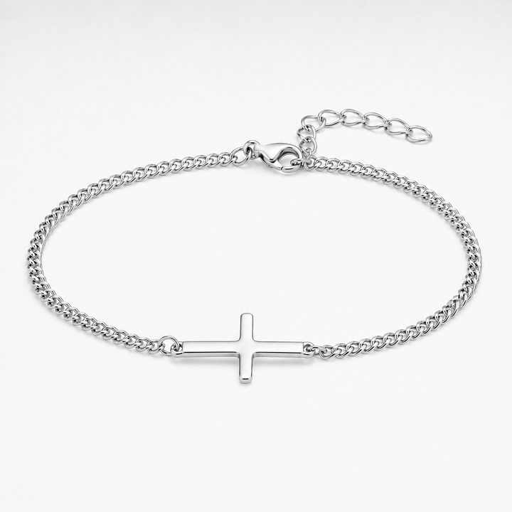 A silver-toned chain bracelet with a flat, polished cross charm in the center, displayed on a clean white background.