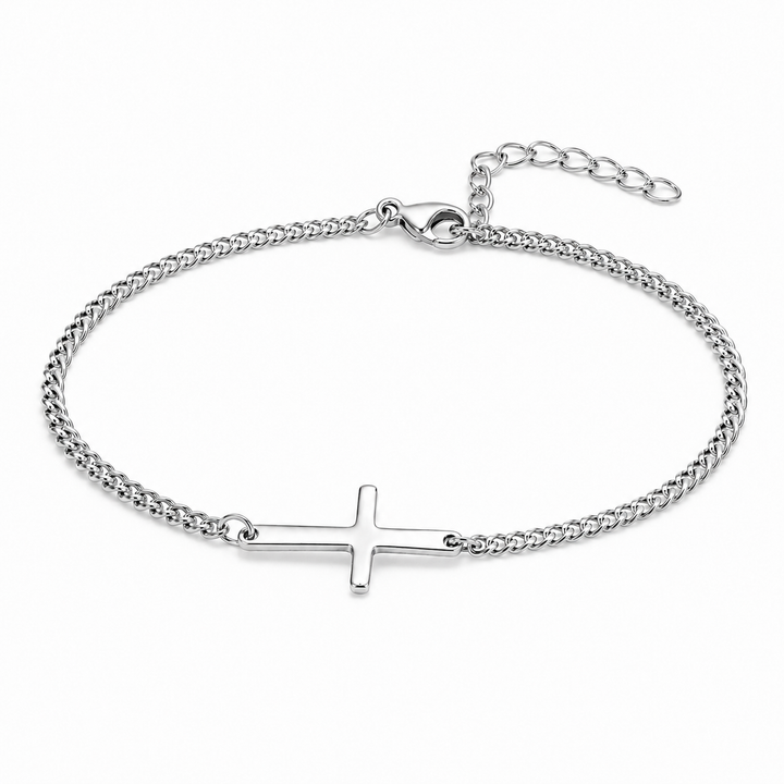 A silver chain bracelet with a flat cross pendant, displayed on a clean white background.