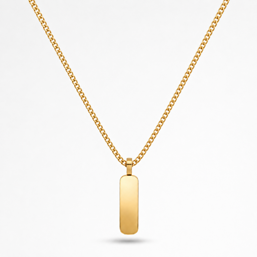 A gold chain necklace with a flat, polished rectangular bar pendant, shown against a clean white background.