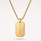 A gold-toned metal necklace with a rectangular dog tag pendant engraved with vertical Roman numerals, shown on a clean light gray background.