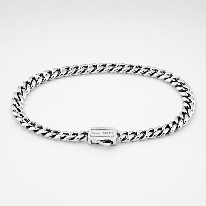 A silver-tone Cuban link chain bracelet with a rectangular clasp engraved with the brand name 'OUTRAGE', displayed on a clean white background.