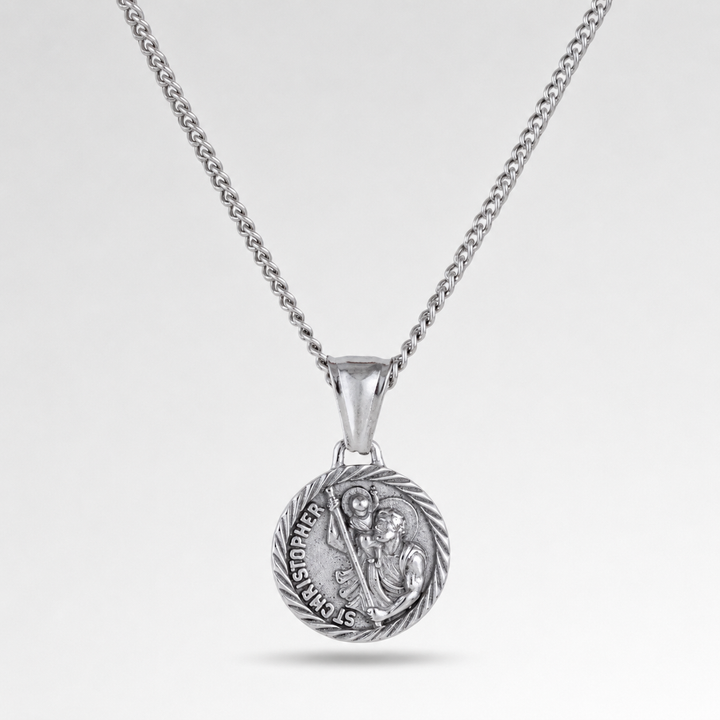 Silver necklace with a pendant on a light gray background