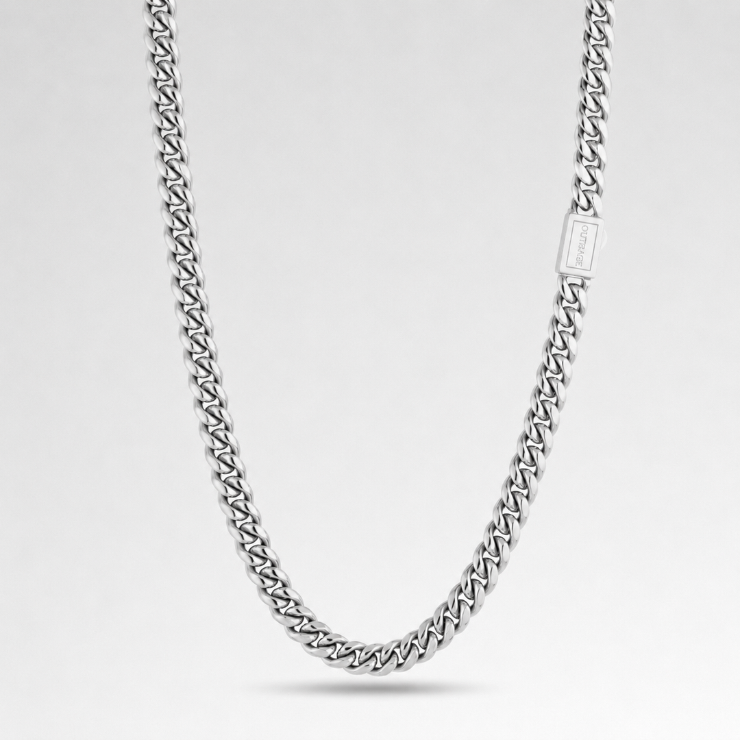 Silver chain necklace on a light gray background