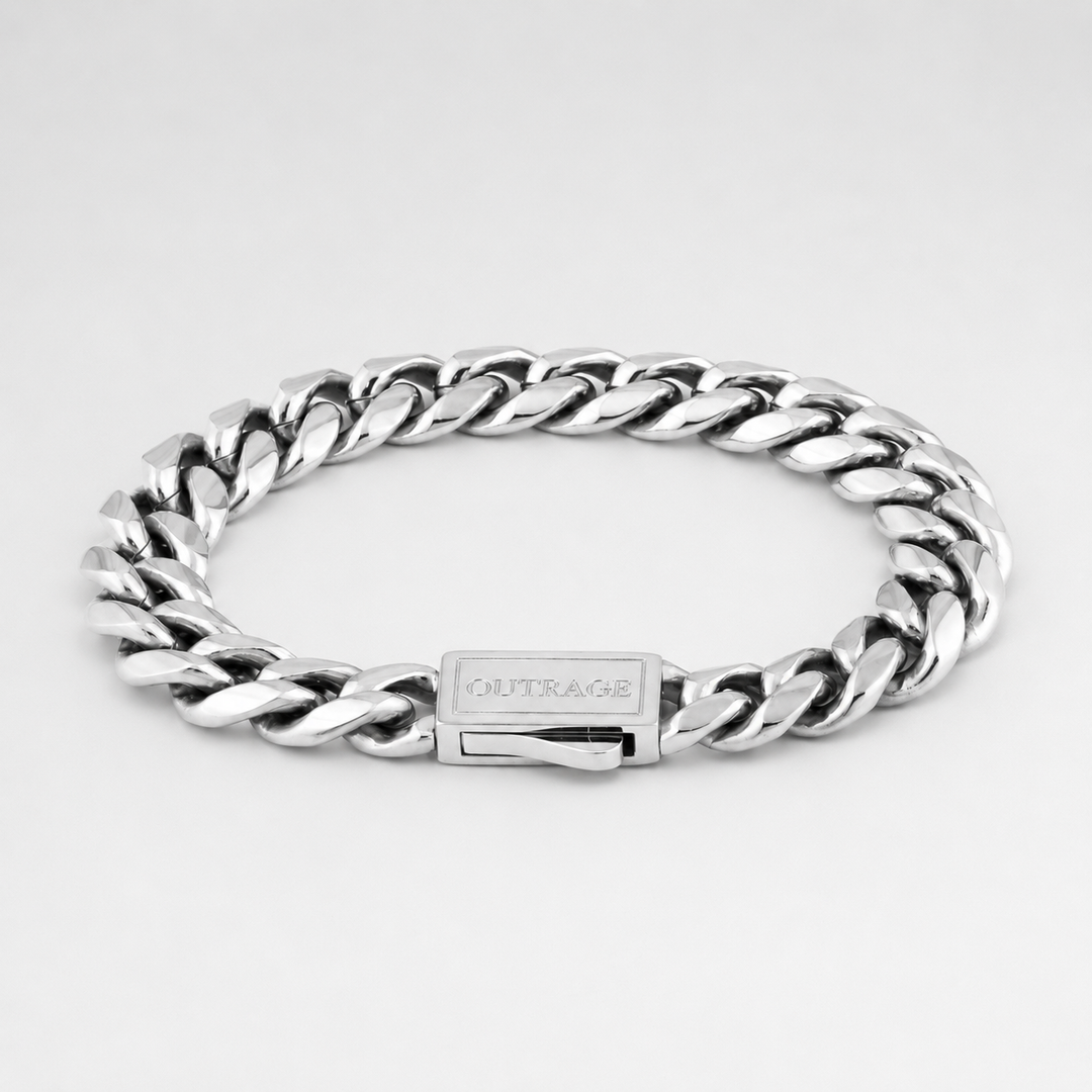 Silver chain bracelet with a visible brand name on a light gray background