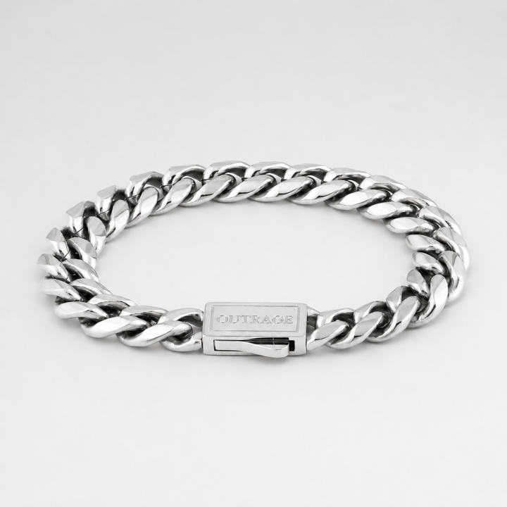 Silver chain bracelet with a visible brand name on a light gray background