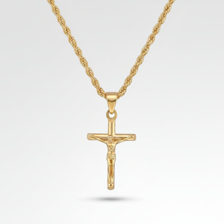 Gold crucifix pendant necklace on a light gray background
