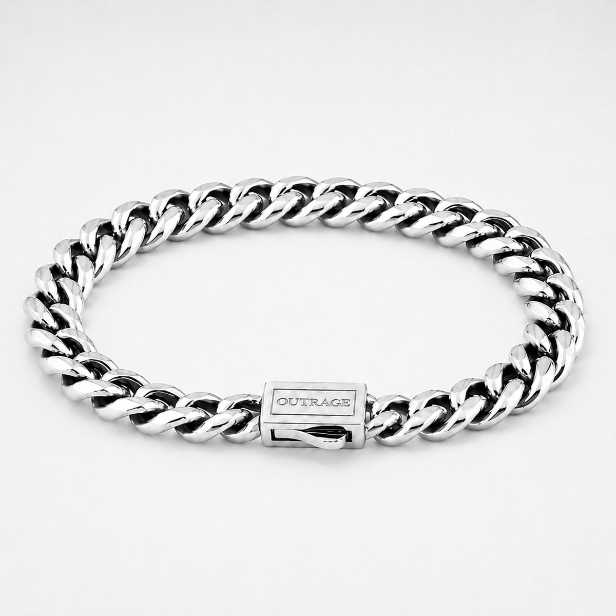 A silver-toned stainless steel curb link bracelet with a rectangular clasp engraved with the brand name 'OUTRAGE', shown on a clean white background.
