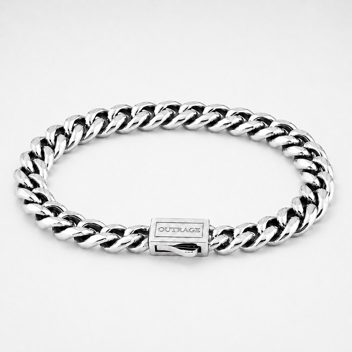A silver-toned stainless steel curb link bracelet with a rectangular clasp engraved with the brand name 'OUTRAGE', shown on a clean white background.