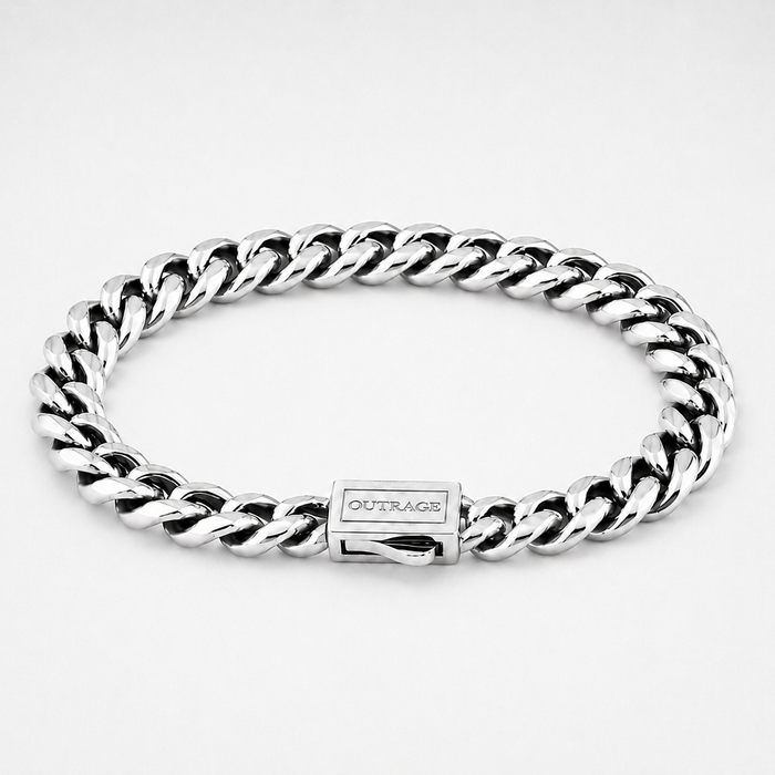 A silver-toned stainless steel curb link bracelet with a rectangular clasp engraved with the brand name 'OUTRAGE', shown on a clean white background.