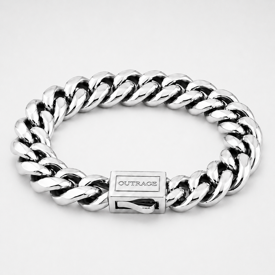 A silver-toned Cuban link chain bracelet with a polished rectangular clasp engraved with the brand name 'OUTRAGE', shown on a light gray background.