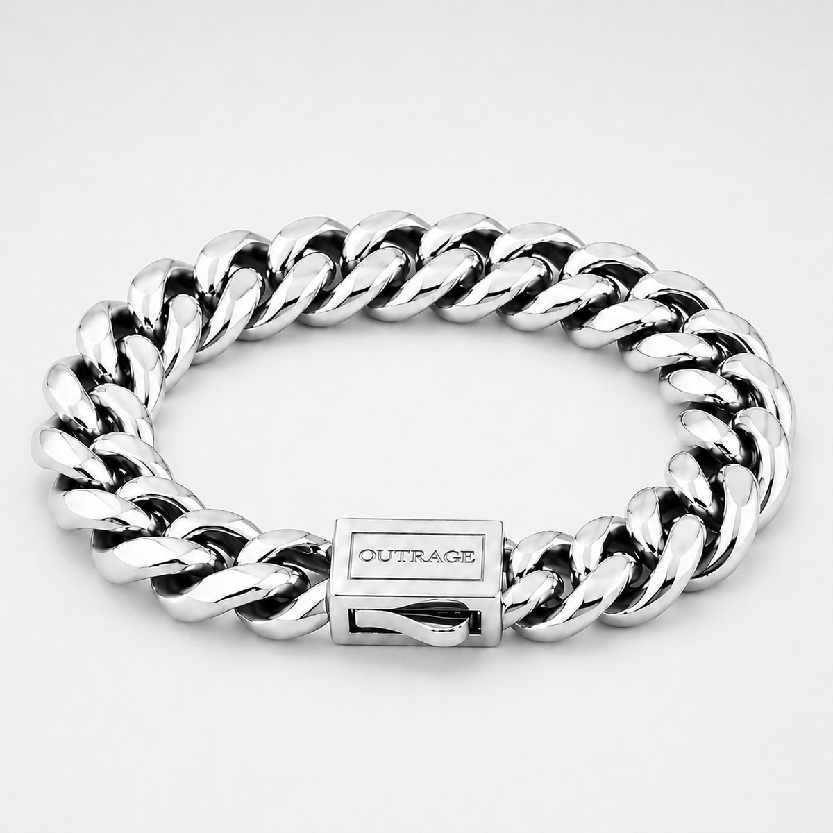 A silver-toned Cuban link chain bracelet with a polished rectangular clasp engraved with the brand name 'OUTRAGE', shown on a light gray background.