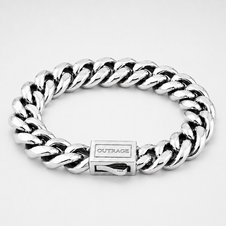 A silver-toned Cuban link chain bracelet with a polished rectangular clasp engraved with the brand name 'OUTRAGE', shown on a light gray background.