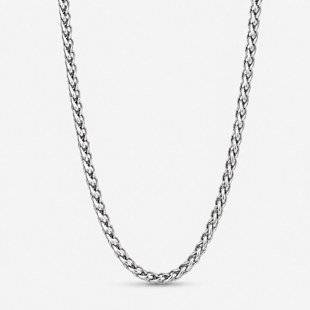 A silver-toned metal chain necklace with a braided curb link design, shown against a plain light gray background.