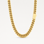A close-up of a gold Cuban link chain necklace with a rectangular branded tag, photographed against a clean white background.
