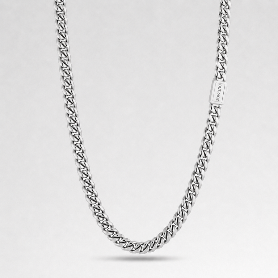 A silver-toned curb chain necklace with a rectangular clasp engraved with the brand name 'JEWELRY', displayed against a clean light gray background.