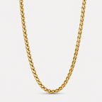 A close-up of a thick, polished yellow gold curb chain necklace forming a U-shape against a clean, light gray background.