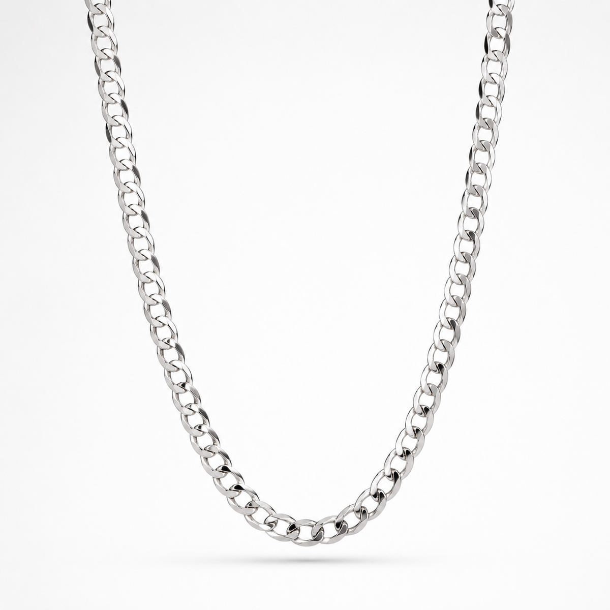 A polished silver-tone curb chain necklace draped in a U-shape against a clean white background.