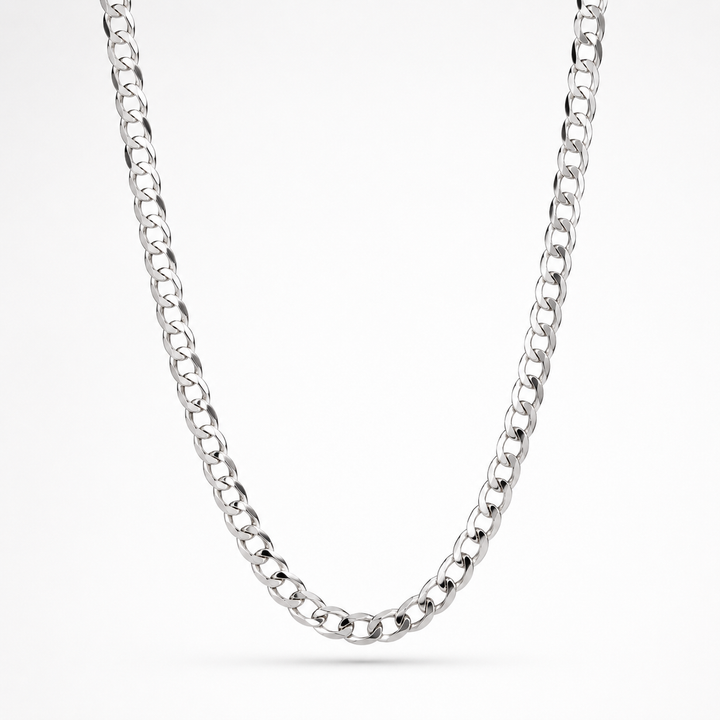 A polished silver-tone curb chain necklace draped in a U-shape against a clean white background.