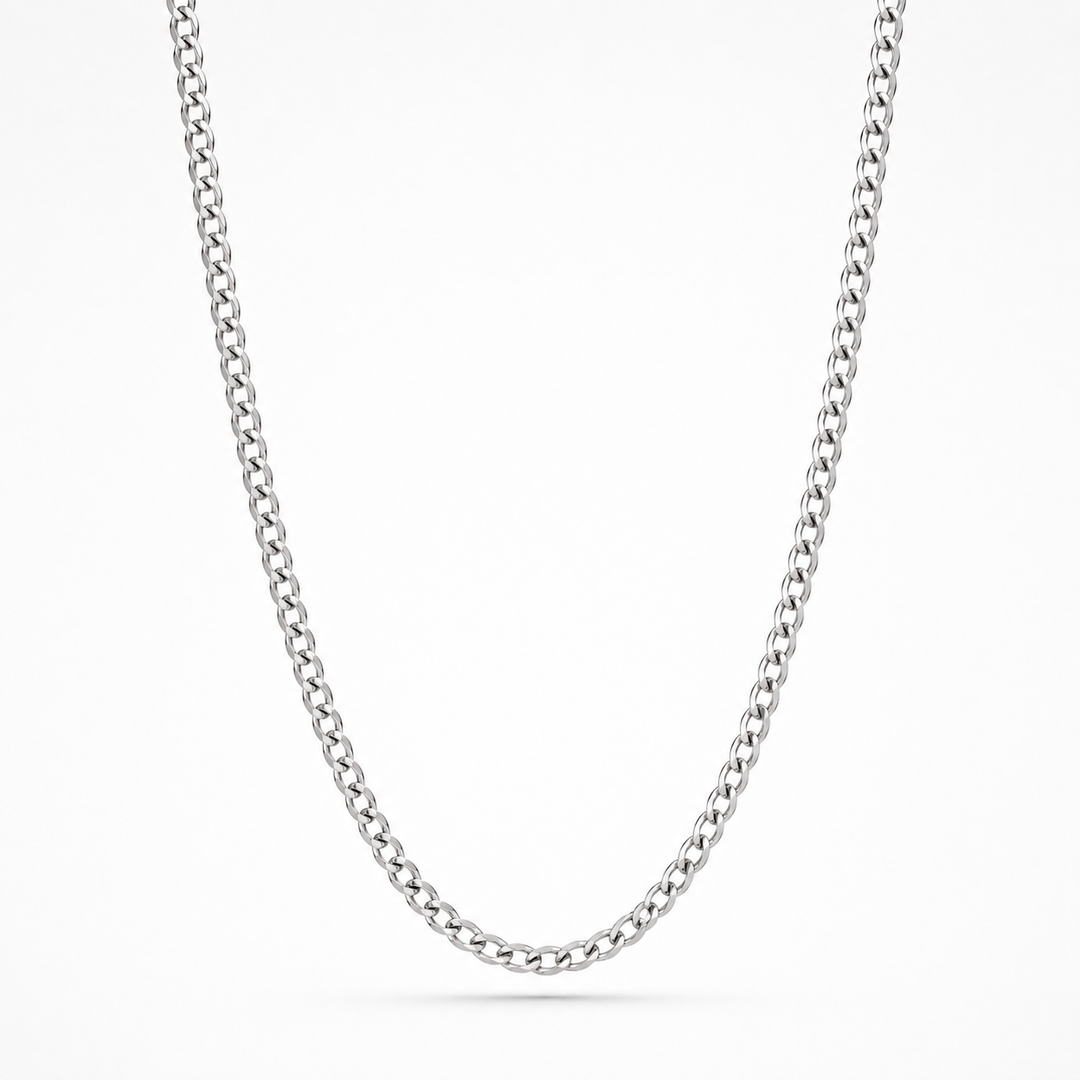 A classic silver-toned curb link chain necklace, shown draped in a U-shape against a clean white background.