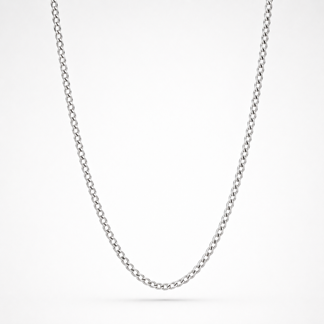 A classic silver curb chain necklace shown in a clean studio setting against a white background.