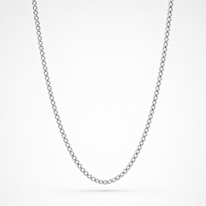 A classic silver curb chain necklace shown in a clean studio setting against a white background.
