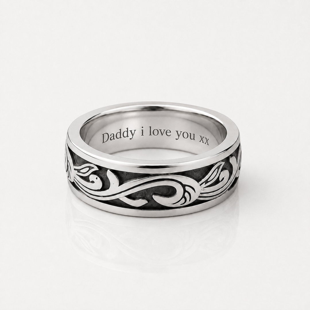 A silver band ring with an engraved black scroll pattern and the text 'Daddy i love you xx' inside, shown on a clean white background.